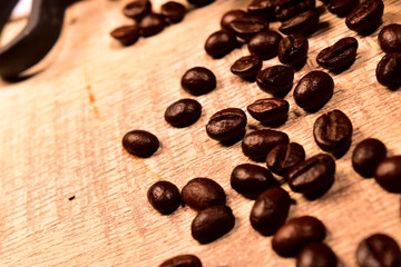 Scattered coffee beans on table