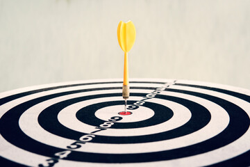 The red dart hit the target. Success and victory in the competition. Competition in American or...