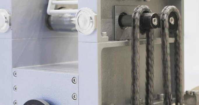 Gear wheel is driving a mechanical chain for some motion on industrial mechanism