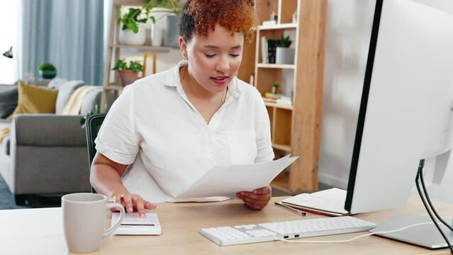 Black woman, accountant and audit in remote work with coffee by computer desk relaxing at home office. African American freelancer in accounting with calculator and documents by PC with cup of drink