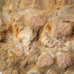 Large stones in the wall as an abstract background.