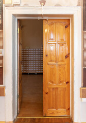 Open wooden door in the room