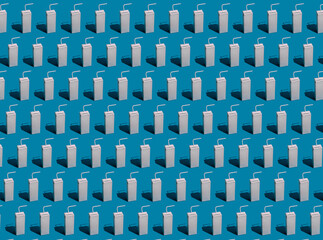 Fototapeta premium Blank Packet Carton Juice & milk pack with straw with hard shadows on a blue background,Repeating seamless pattern.