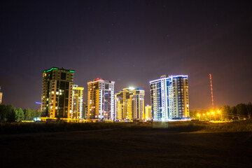 Fototapeta na wymiar View of the new buildings of Obninsk at night, Russia