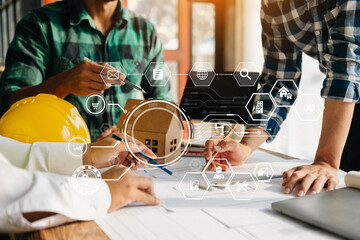 three colleagues discussing data working and tablet, laptop with on on architectural project at construction site at desk in office.