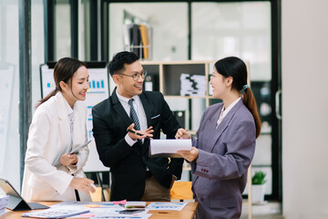 Portrait of success business people working together in home office. Couple teamwork startup concept.