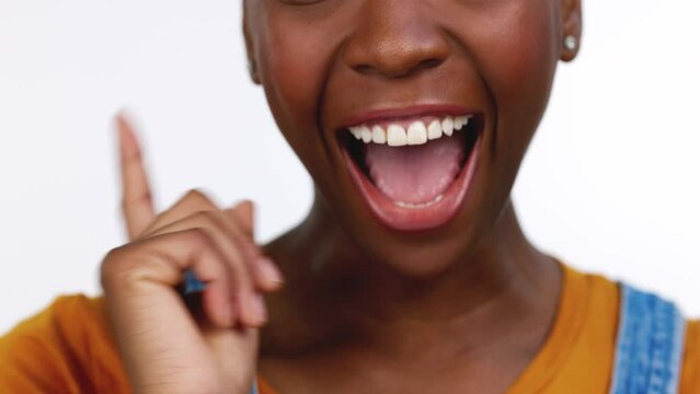 Thinking, wow and lightbulb moment with a black woman in studio isolated on a white background. Hand, idea and breakthrough with an african female feeling excited while contemplating a thought