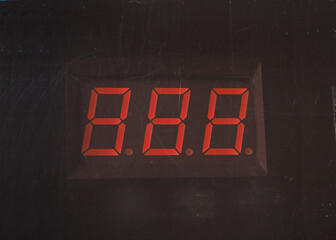 3-digit number led display with dirty face. Scratched face on dim display.