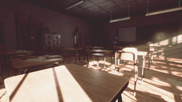 View to classroom with tables and small blackboard and grungy walls