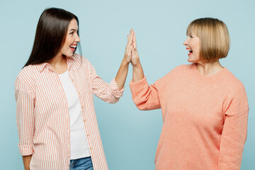 Elder parent mom with young adult daughter two women together wear casual clothes meet together...