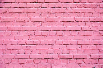 Fototapeta na wymiar old brick wall painted in pink color