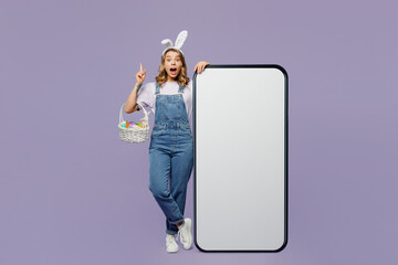 Full body smart young woman wear casual clothes bunny rabbit ears near big huge blank screen mobile...