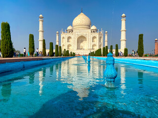 Naklejka premium Agra, Uttar Pradesh, India - 12.15.2022: Taj Mahal, Agra, India. Tourists visiting a popular tourist attraction.