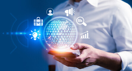 Businessman using smart phone with virtual business icons to improve success goals target