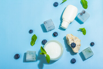 Natural skincare. Cream or lotion with organic berries. Blueberry, mint, and ice. Moisturizing