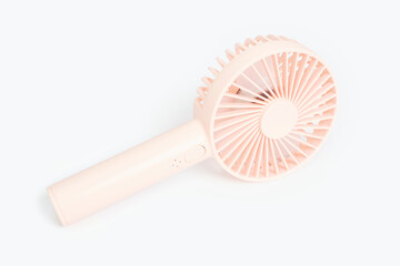 Small portable fan on white background close-up, copy space. © TATIANA KIM