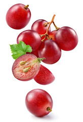 Grape isolated. Pink grape with leaves on white background. Violet red grapes flying collection....