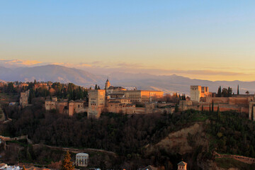 Fototapeta na wymiar view over the alhambra of Granada with snow covered mountains in the background