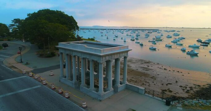 aerial plymouth rock sunrise harbor small vessels marina docked massachusetts drone