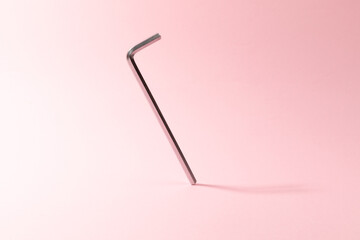 allen wrenches on pink background