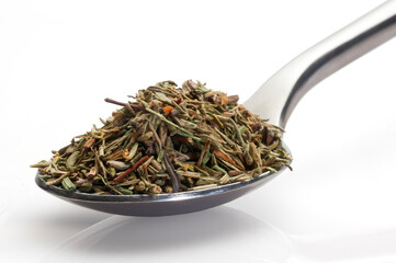 thyme in a spoon on white background
