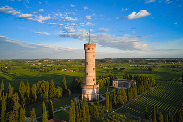 The famous tower on lake garda tower of san martino della battaglia aerial view. Tower at sunset...