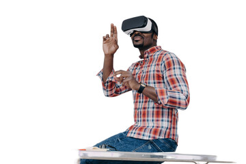 African american guy software developer in virtual reality glasses creates app, sits on office desk