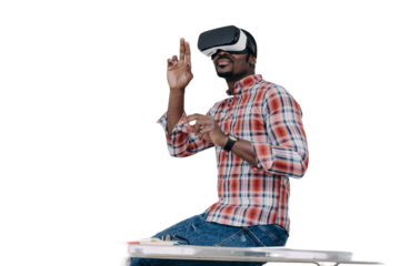 African american guy software developer in virtual reality glasses creates app, sits on office desk