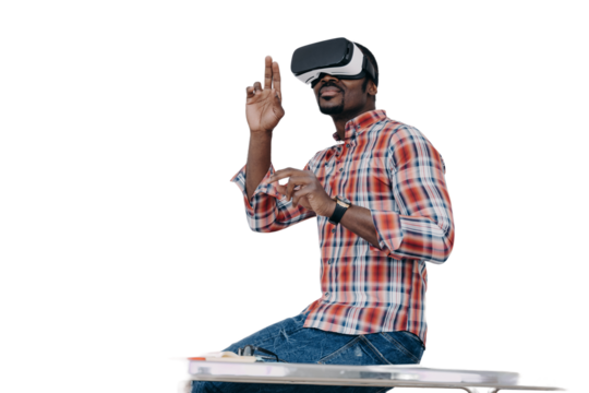 African american guy software developer in virtual reality glasses creates app, sits on office desk