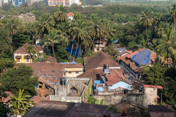 Fototapeta premium Aerial view of the tiled roofs of old houses in the Fontainhas district of Panaji.