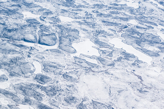 Aerial Image of Black Carbon Soot on Ice and Rock over the landscape of the Canadian Arctic.