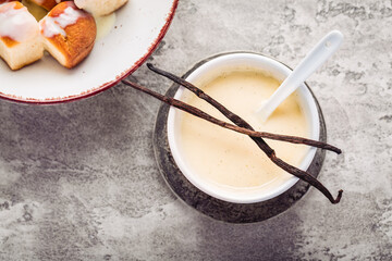 Buchteln, sweet rolls made of yeast dough with milk and butter, served with vanilla sauce