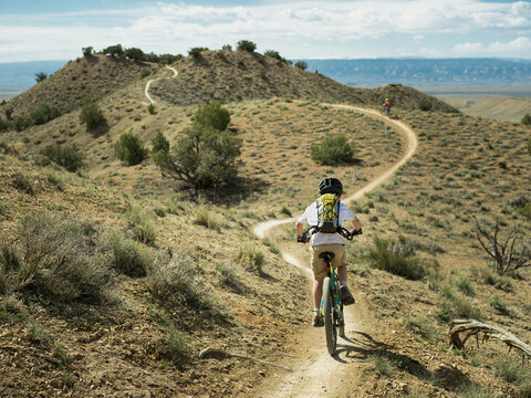 A young boy mountain biking on the 18 Road Trails near Fruita, Colorado