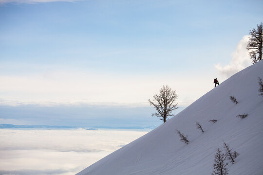 A backcountry skier skins up a ridge on Gash Point in the Bitterroot Mountain Range, Montana.