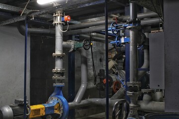 Steel pipes, tubes, steam turbine, valves, machinery, cables of modern factory. Gas boiler room of industrial zone power plant. Pump engineering station. Technical equipment system. Energy concept.