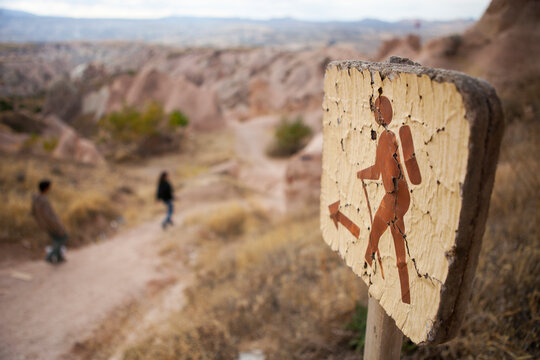 A sign pointing to a hiking path in the Devrent valley in Cappadocia, Turkey.