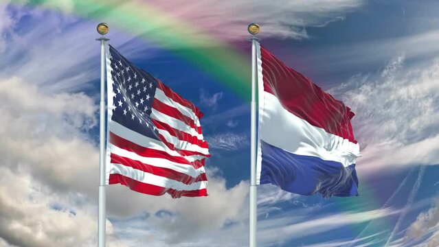 The flags of the United States and the Netherlands fly in the sky with a rainbow in the background, captured in 4k resolution at 60 frames per second.