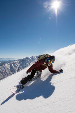 Sandra Hillen Snowboarding In The Backcountry Taking A Turn In A Fresh Snow Powder