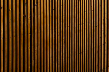Wall of wooden slats. Wooden floor. Wooden fence. Wooden wall. Modern architectural wall.