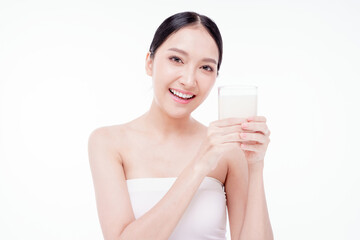 Young happy woman 20s wear white t-shirt hold glass of milk isolated on white background studio. Healthy drink lifestyle concept