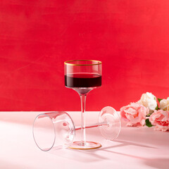 Wine glass on pink background and backdrop