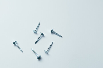 Set of metal nail head isolated on white background. Metallic nail for joining wooden detail. Handcrafted metal nails