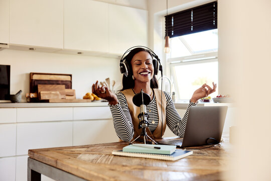 Laughing woman doing a podcast