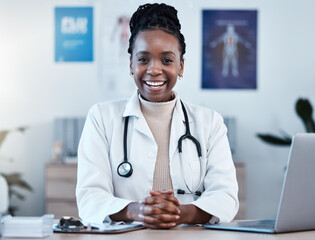 Black woman, doctor in portrait and healthcare, smile in office and laptop, medical professional and happy in career. Female physician, hands and health mindset with cardiologist at clinic and leader