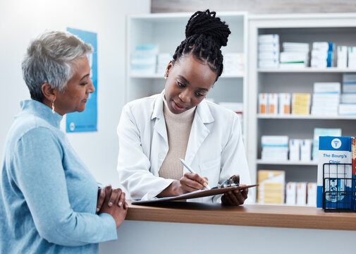 Pharmacy, healthcare or clipboard with a customer and black woman pharmacist in a dispensary. Medical, insurance and trust with a female medicine professional helping a patient in a drugstore
