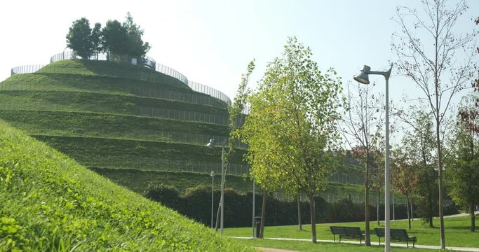 Ziggurat gardens. Park with ziggurat hill.Green hill and public gardens in the Portello district in Milan. 