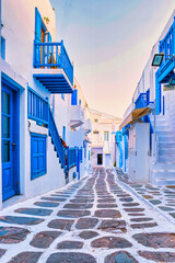 empty street of Mykonos Greek village in Greece, colorful streets of Mikonos village. - obrazy, fototapety, plakaty