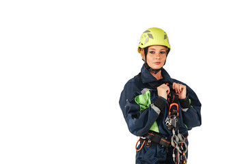 Serious young woman in industry uniform and protective helmet posing at isolated white empty...