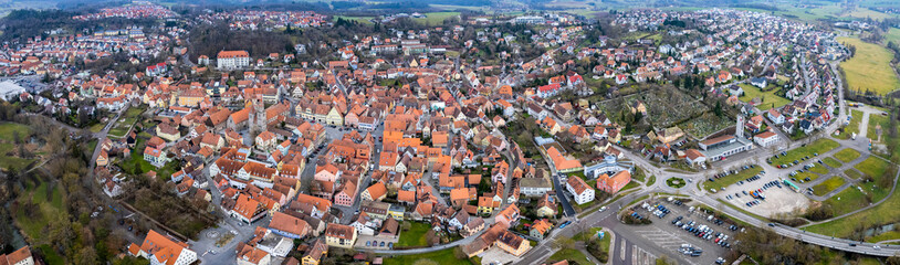 Fototapeta na wymiar Aerial around the city Feuchtwangen on a sunny day in winter
