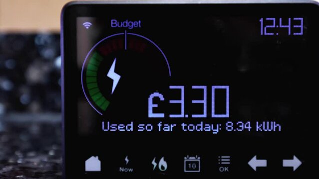 Time lapse of a home electricity smart meter representing the increasing cost of energy consumption during the cost of living crisis.  Zoom in.